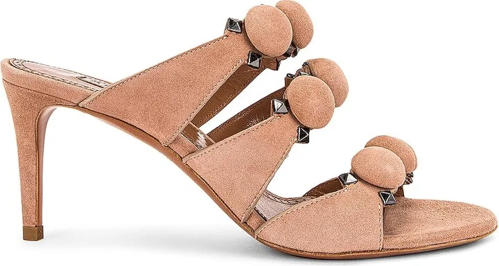 ALAÏA Pom Pom Studded Mules in Beige