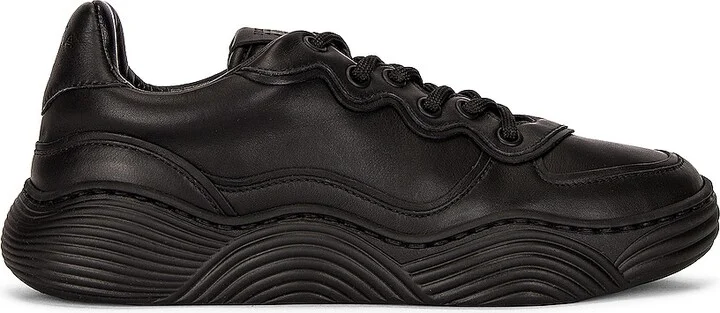 ALAÏA Veau Wave Sneakers in Black