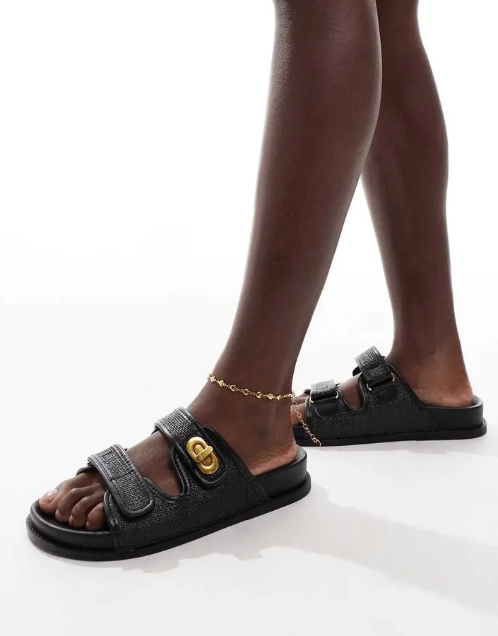 ASOS DESIGN Fawn footbed sliders with twist lock in black