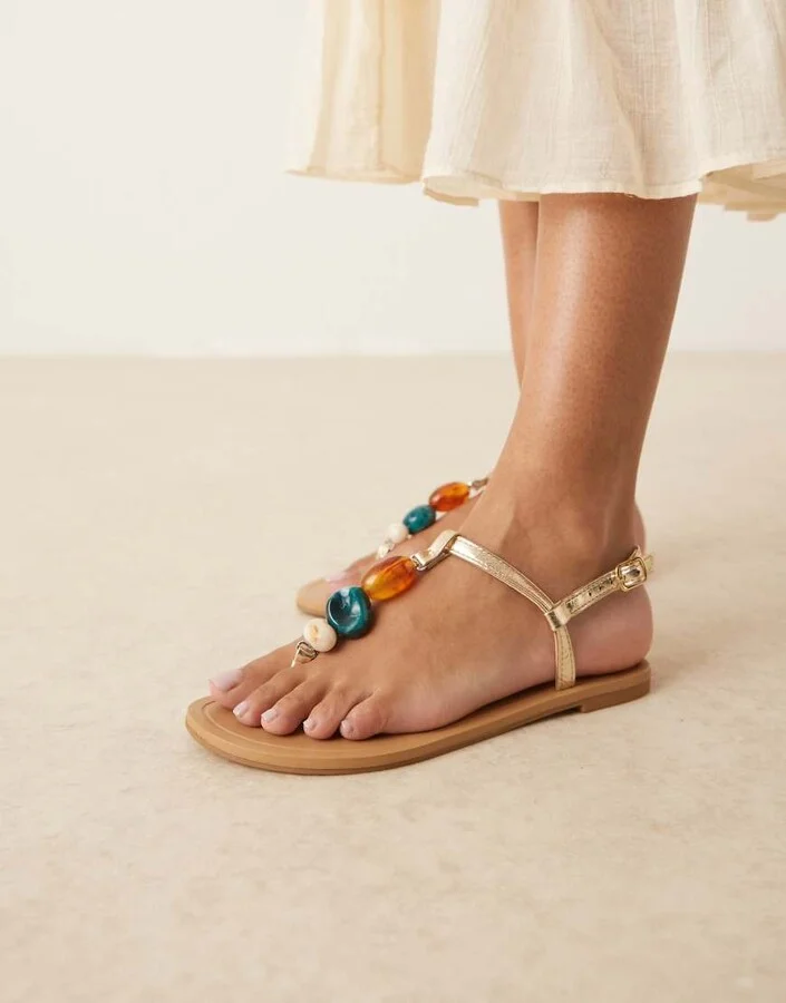 ASOS DESIGN Feud toe post flat sandals with stones in gold