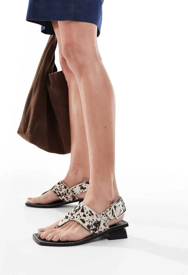 ASOS DESIGN Film leather heeled toe thong sandals in cow print - Image 4