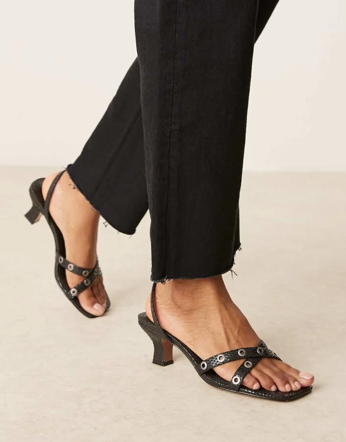ASOS DESIGN Hyatt eyelet detail mid heeled mules in black snake