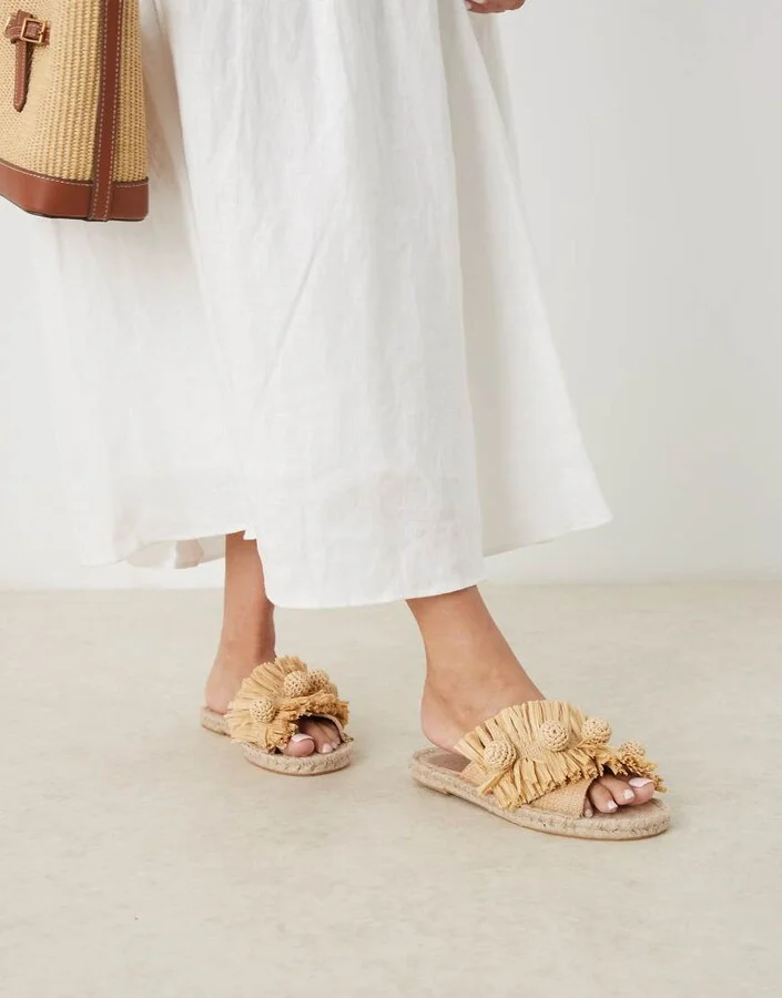 ASOS DESIGN Jovie raffia pom-pom espadrille mules in natural
