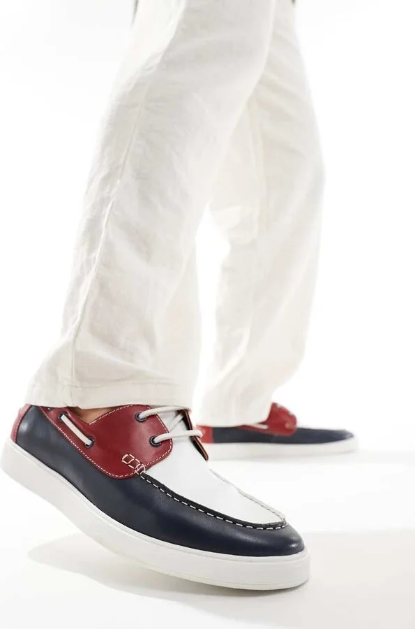 ASOS DESIGN lace up boat shoes in navy suede with red and white details