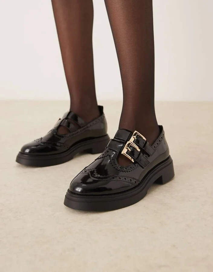 ASOS DESIGN Marigold chunky buckle detail flat shoes in black