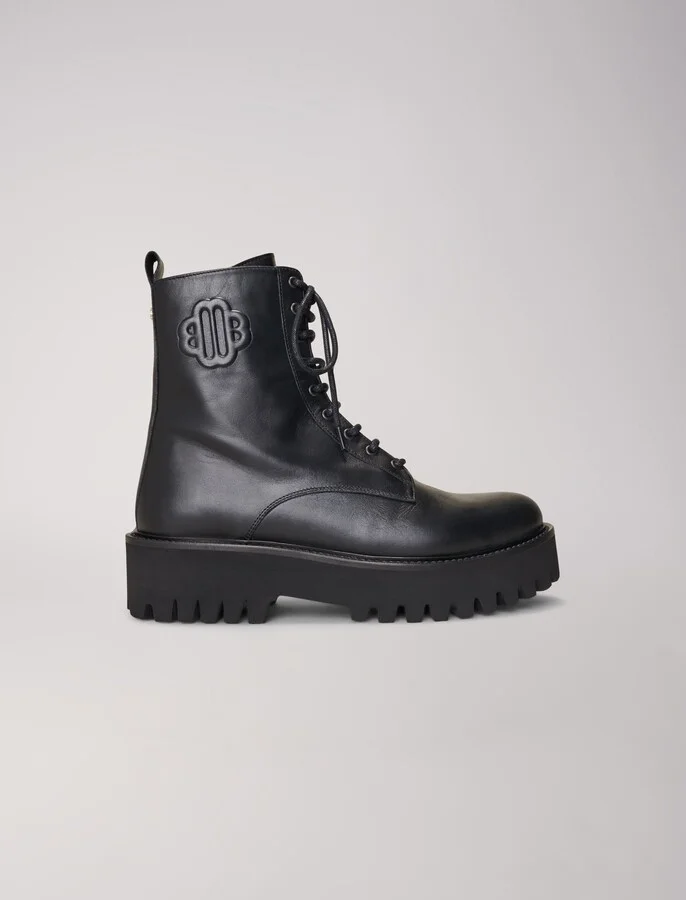 Black leather lace-up boots