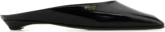Black leather slippers