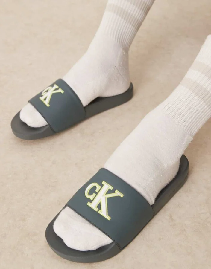 Calvin Klein Jeans large logo slides in teal, lime, and white - Image 4
