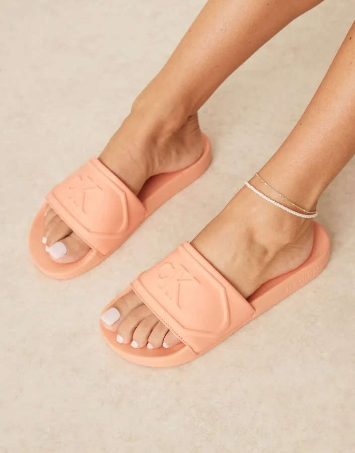 Calvin Klein Jeans logo puff slides in pastel orange