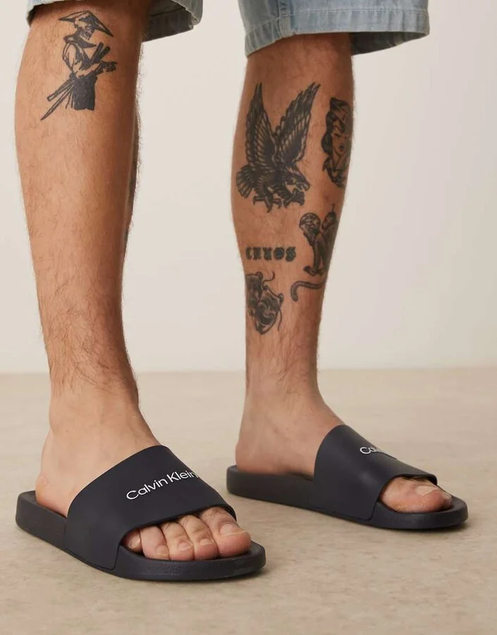 Calvin Klein logo slides in navy