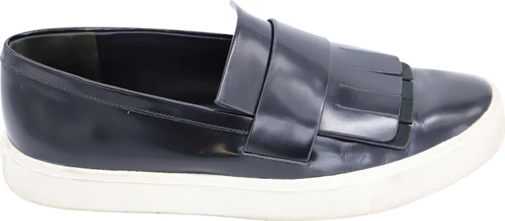 Conventry Kiltie Fringe Slip-On Sneakers in Black Leather