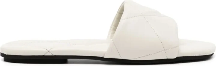 Eagle-motif quilted sandals