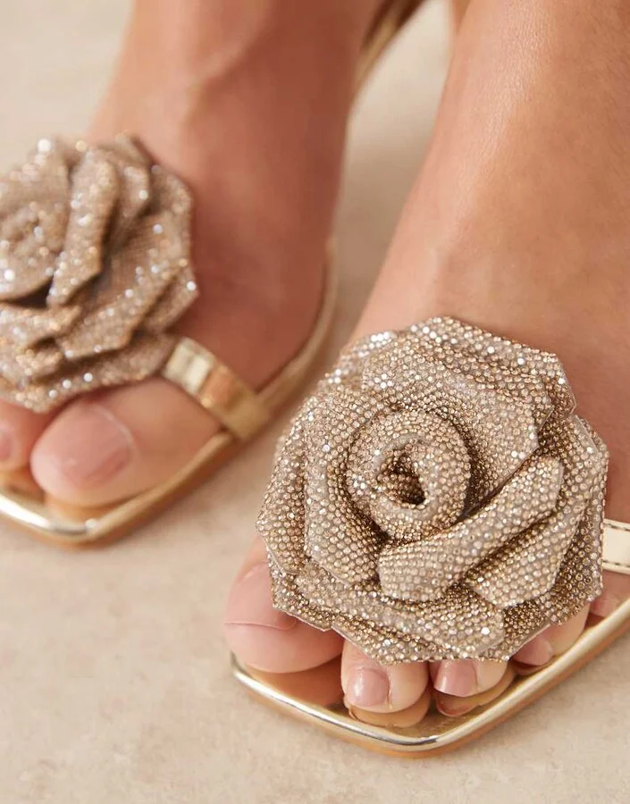 Glamorous stiletto heeled sandals wth flower details in gold - Image 2