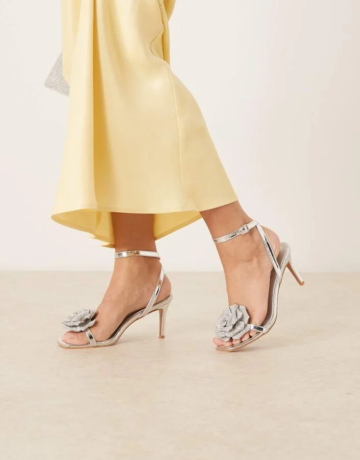 Glamorous stiletto heeled sandals wth flower details in silver