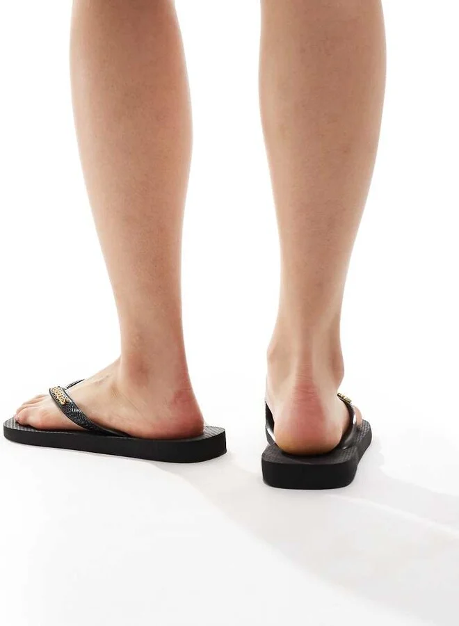 Havaianas classic metal logo flip flops in black - Image 3