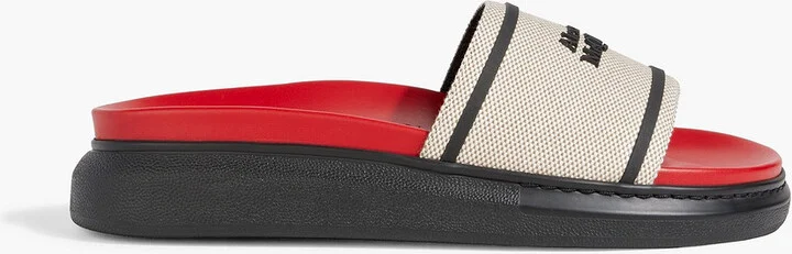 Hybrid logo-embellished canvas slides