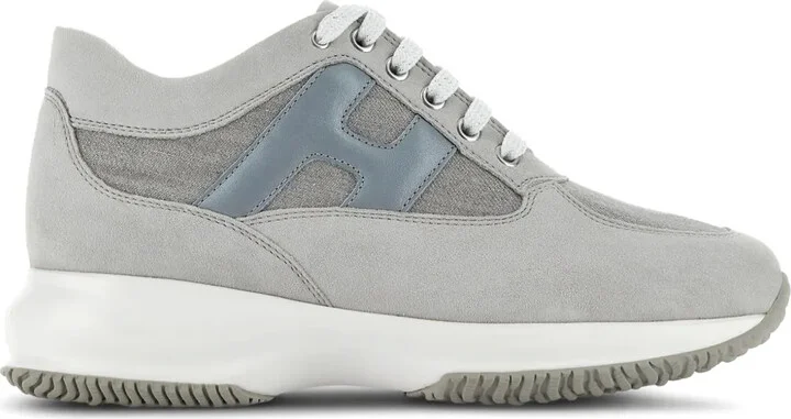 Interactive logo-embossed sneakers