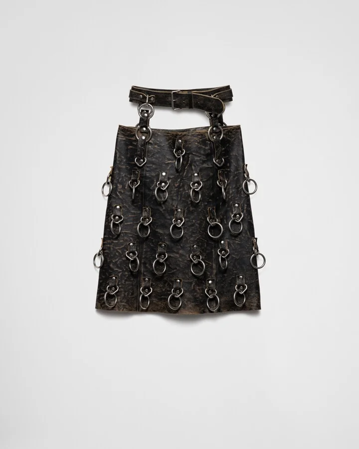 Leather miniskirt with metal rings