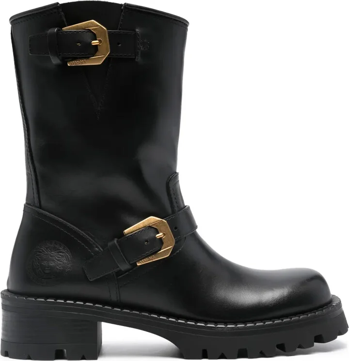 Medusa-embossed leather boots