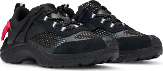 Mixed-material trainers with decorative reflective effects