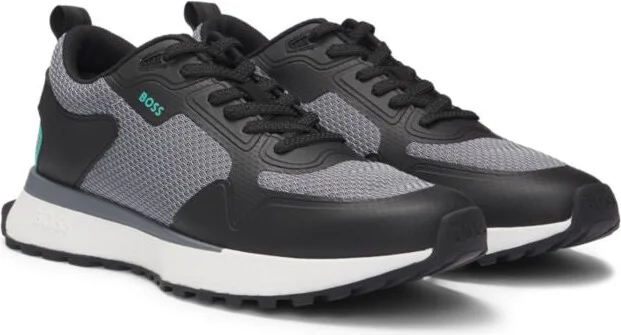 Mixed-material trainers with mesh details and branding