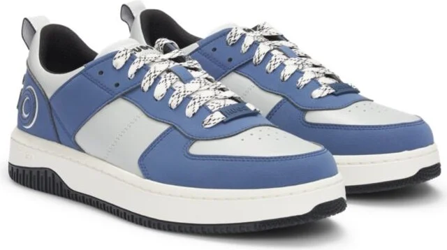 Mixed-material trainers with two sets of laces