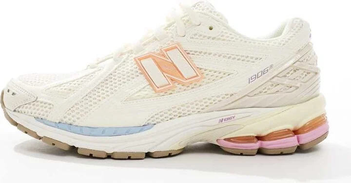 New Balance 1906 sneakers in white with blue and pink details