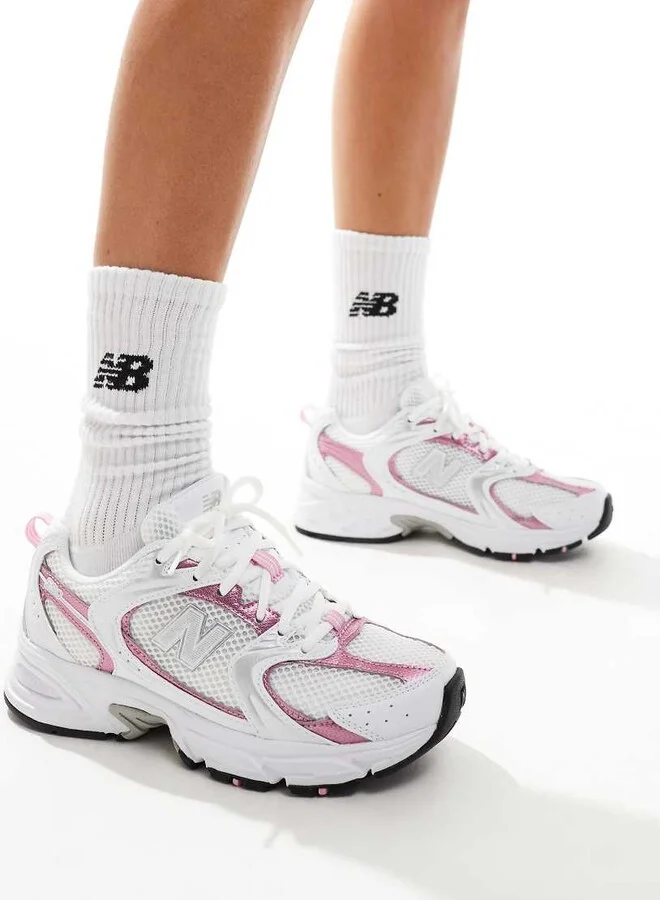 New Balance 530 sneakers in white with pink metallic details