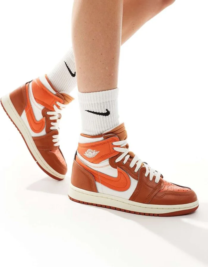 Nike Air Jordan 1 high sneakers in white and orange