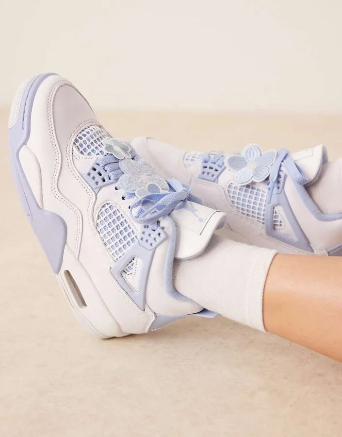 Nike Air Jordan 4 Retro sneakers in white and light blue