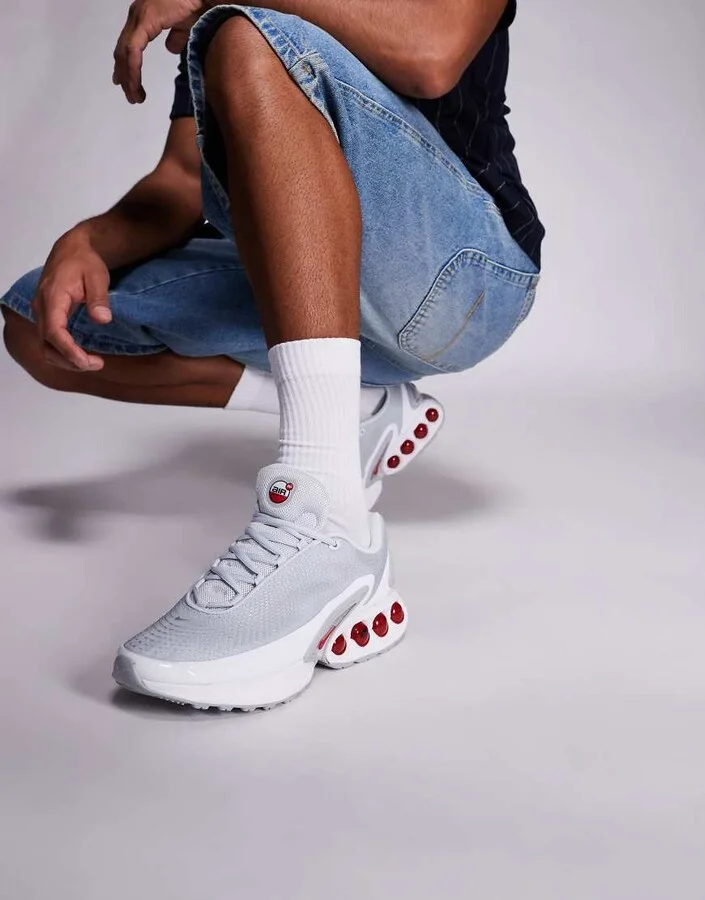 Nike Air Max DN sneakers in light gray and red