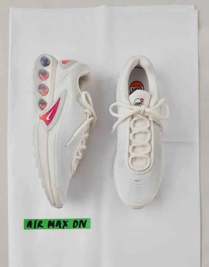 Nike Air Max DN sneakers in off white and purple