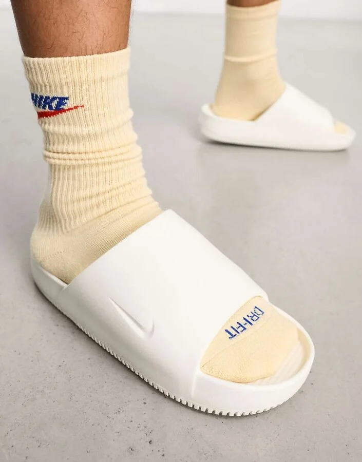 Nike Calm Mule slides in off white