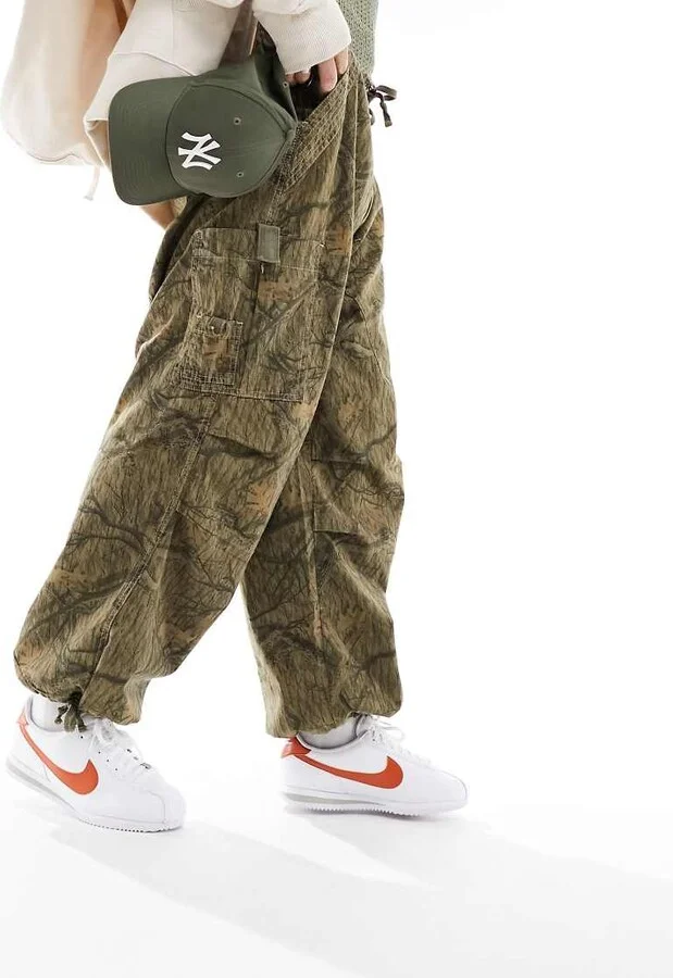Nike Cortez leather sneakers in white and orange - Image 2