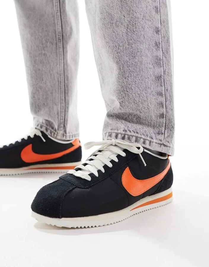 Nike Cortez sneakers in black and orange