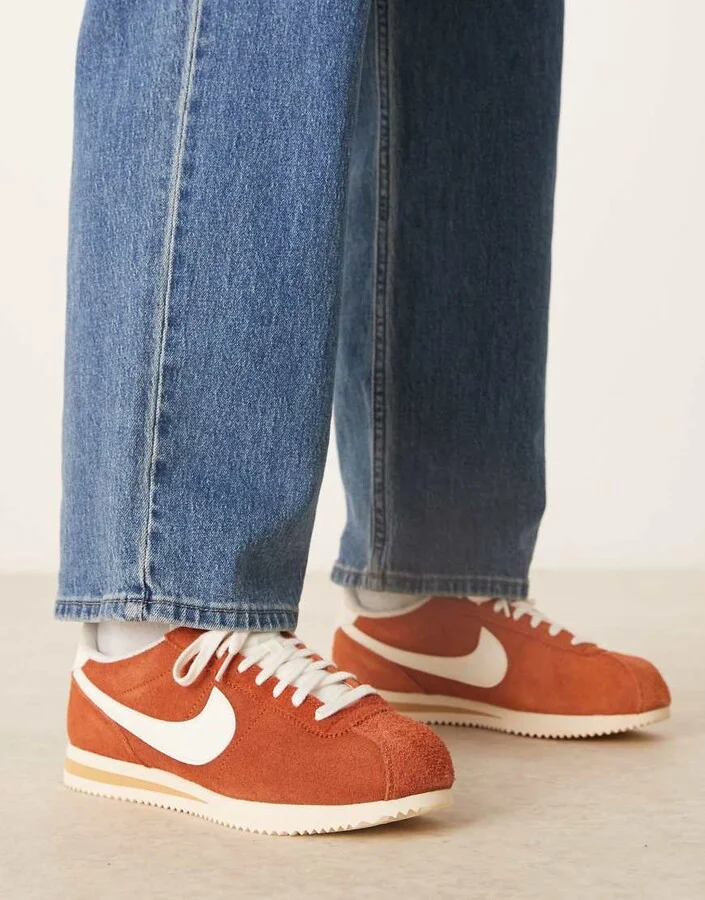 Nike Cortez suede sneakers in orange and white