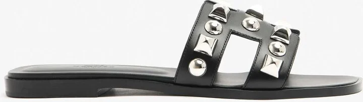 Oran H Cut-Out Sandals in Black Calfskin and Medor Studs