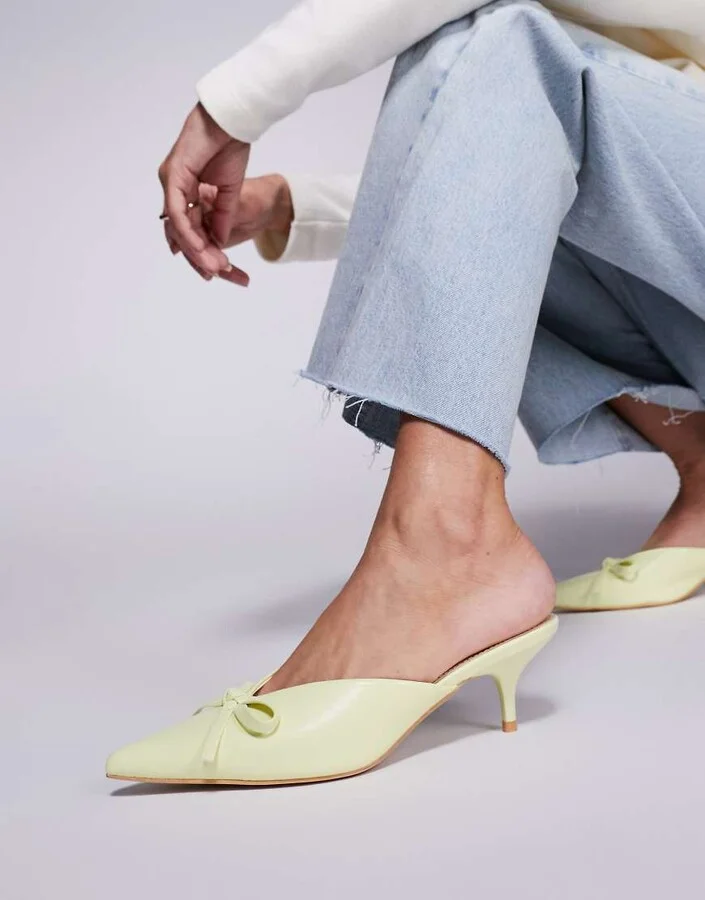 Public Desire Lionheart pointed kitten heel mules with bow in yellow