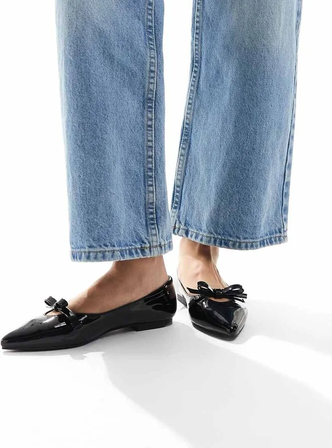 schuh Larisa bow pointed toe ballet flats in black patent