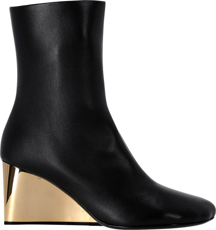 Short black boots with gold base