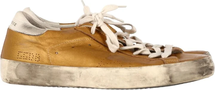 Superstar Perforated Sneakers in Gold Leather