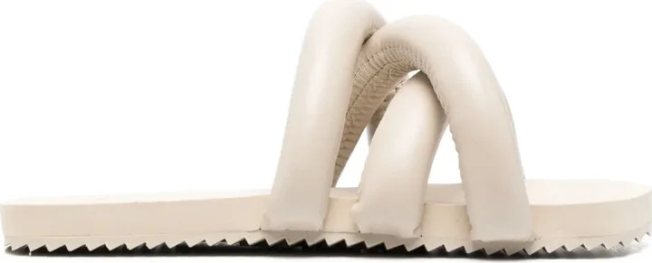 Tyre crossover-strap slides