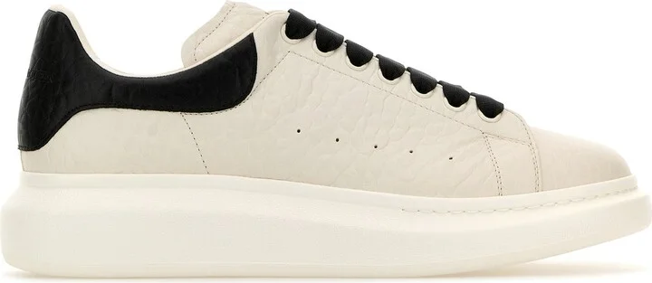 White leather sneakers with black leather heel