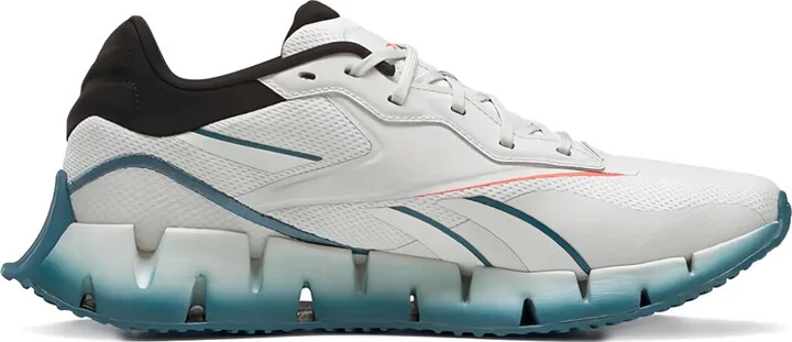 Zig Dynamica 4 "Pure Grey Orange Flared" trainers